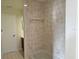 Shower with beige tiles and a shower/tub combo at 345 Feather Pl, Longwood, FL 32779