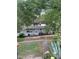 Charming single-story home with mature trees and a fenced yard for added privacy and curb appeal at 3600 Ne 22Nd Ct, Ocala, FL 34479