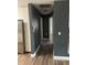 Hallway leading to multiple rooms, featuring modern flooring and updated paint at 3600 Ne 22Nd Ct, Ocala, FL 34479