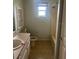 Functional bathroom featuring a single sink vanity, and standard tub-shower combination at 42 Banyan Pass, Ocala, FL 34472