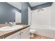 Comfortable bathroom with a soaking tub and shower combination at 433 Tangerine Ave, Lake Helen, FL 32744