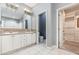 Bathroom featuring a dual sink vanity, tile flooring, and an adjoining closet at 433 Tangerine Ave, Lake Helen, FL 32744