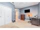 Neutral-toned bedroom featuring a desk, dresser, and closet, all ready for personalization at 433 Tangerine Ave, Lake Helen, FL 32744