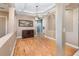 Dining room with hardwood floors, decorative mirror, and stylish light fixture at 433 Tangerine Ave, Lake Helen, FL 32744