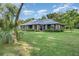 Charming single-story home with lush landscaping and large front yard at 433 Tangerine Ave, Lake Helen, FL 32744