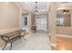 Elegant foyer with marble flooring, arched doorways, and tray ceiling at 433 Tangerine Ave, Lake Helen, FL 32744