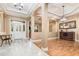 Welcoming foyer with marble tile, an ornate front door, and wood flooring leading to living areas at 433 Tangerine Ave, Lake Helen, FL 32744