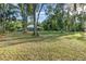 Beautiful front yard with mature trees offering privacy at 433 Tangerine Ave, Lake Helen, FL 32744
