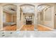 Spacious hallway showcases architectural columns, hardwood flooring, and stylish lighting fixtures at 433 Tangerine Ave, Lake Helen, FL 32744