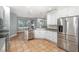 Bright kitchen features stainless steel appliances, a tile backsplash, and an open layout at 433 Tangerine Ave, Lake Helen, FL 32744