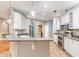 Well-equipped kitchen with granite countertops, stainless steel appliances, and ample cabinet space at 433 Tangerine Ave, Lake Helen, FL 32744