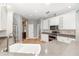Bright kitchen features white cabinets, stainless steel appliances, and tile backsplash at 433 Tangerine Ave, Lake Helen, FL 32744