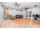 Spacious living room with hardwood flooring, neutral walls, and access to other areas of the home at 433 Tangerine Ave, Lake Helen, FL 32744