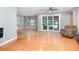 Spacious living room with hardwood floors, large windows, and a ceiling fan at 433 Tangerine Ave, Lake Helen, FL 32744
