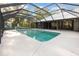 A beautiful enclosed pool with a diving board for summer fun! at 433 Tangerine Ave, Lake Helen, FL 32744