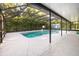 Enclosed pool features a basketball hoop for recreational enjoyment at 433 Tangerine Ave, Lake Helen, FL 32744