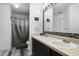 Bathroom featuring dual sinks, decorative mirrors, and modern fixtures providing practical amenities at 460 Flamingo Ct, Kissimmee, FL 34759