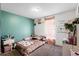 Cozy bedroom with personal touches, featuring unique decor and ample natural light for a warm ambiance at 460 Flamingo Ct, Kissimmee, FL 34759
