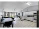 Bright kitchen with a breakfast bar, white cabinets, and an open layout flowing into the living area at 460 Flamingo Ct, Kissimmee, FL 34759