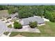 Desirable single-story home featuring a two-car garage, long driveway, and mature trees at 4643 Fern Pine Dr, Orlando, FL 32808