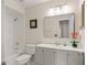 Bright bathroom with tiled shower-tub combo and modern vanity at 4643 Fern Pine Dr, Orlando, FL 32808