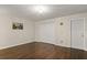 Spacious bedroom features double closet, door to hall, and wood flooring at 4643 Fern Pine Dr, Orlando, FL 32808
