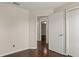 This bedroom features wood flooring and access to additional rooms at 4643 Fern Pine Dr, Orlando, FL 32808