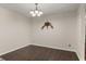 Dining area with wood floors and decorative chandelier is an ideal setting at 4643 Fern Pine Dr, Orlando, FL 32808