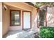 Inviting front entrance with a white door, brown trim, and well-kept landscaping for a welcoming first impression at 4643 Fern Pine Dr, Orlando, FL 32808