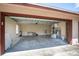 Spacious two car garage interior with workbench, water heater, and plenty of room for storage at 4643 Fern Pine Dr, Orlando, FL 32808
