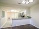Modern kitchen with granite countertops and stainless steel appliances at 4643 Fern Pine Dr, Orlando, FL 32808