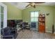 Bright home office space with a vaulted ceiling, ceiling fan and a large window at 4843 Pierce Arrow Dr, Apopka, FL 32712