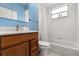 Bright bathroom with updated vanity, modern fixtures, and a shower-tub combination at 507 Westwind Dr, Davenport, FL 33896