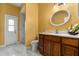 Bathroom featuring vanity, toilet, marble floors, and glass shower at 507 Westwind Dr, Davenport, FL 33896