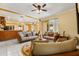 Comfortable living room with a view into the kitchen, modern furniture, and natural light at 507 Westwind Dr, Davenport, FL 33896