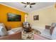 Comfortable living room with bright walls, tile floors, a ceiling fan, and modern furniture at 507 Westwind Dr, Davenport, FL 33896