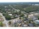 Expansive aerial view shows a residential area interspersed with trees and a water tower at 528 Courtland Blvd, Deltona, FL 32738