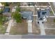 Aerial view of a home with a driveway, yard, and surrounding neighborhood at 528 Courtland Blvd, Deltona, FL 32738