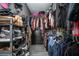 Walk-in closet with racks and shelves filled with an array of shoes, clothing, and accessories for optimal organization at 528 Courtland Blvd, Deltona, FL 32738