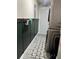 The laundry room features a stacked washer/dryer unit and a green accent wall at 528 Courtland Blvd, Deltona, FL 32738
