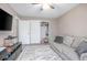 Cozy living room featuring a comfortable sofa, flat screen tv, and a closet for storage at 528 Courtland Blvd, Deltona, FL 32738