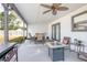 Outdoor patio features a dining table, ceiling fan, and fire pit, perfect for outdoor entertaining at 528 Courtland Blvd, Deltona, FL 32738