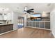 Living room with wood floors and open access to the kitchen and outdoor pool area at 5338 Tangerine Ave, Winter Park, FL 32792