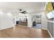 Open-concept living area with hardwood floors, modern lighting, and seamless flow at 5338 Tangerine Ave, Winter Park, FL 32792