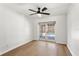 Empty living room boasting luxury vinyl plank flooring with direct backyard access at 5338 Tangerine Ave, Winter Park, FL 32792