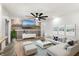 Bright living room featuring a modern ceiling fan, recessed lighting, and stylish decor at 5338 Tangerine Ave, Winter Park, FL 32792