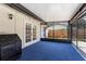 Covered patio with blue flooring and an outdoor fireplace, perfect for relaxing and entertaining at 5338 Tangerine Ave, Winter Park, FL 32792