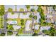 Aerial view showcases the community's layout, including buildings, pool, parking and tennis courts at 5395 Dover Village Ln # 305, Orlando, FL 32812