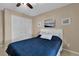 Cozy bedroom with ceiling fan and built-in closet, creating a comfortable and functional space at 5395 Dover Village Ln # 305, Orlando, FL 32812