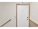 Interior doorway with a white door and wood trim at 5395 Dover Village Ln # 305, Orlando, FL 32812